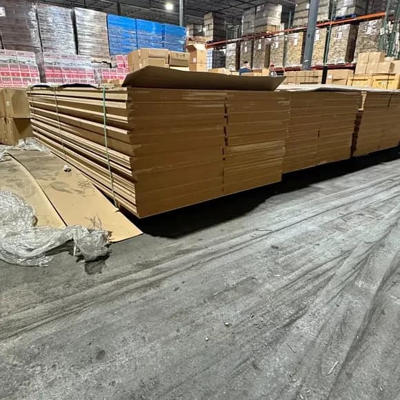 New MDF boards stacked in a warehouse